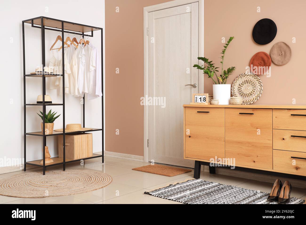 Stylish interior of modern hall with rack and sideboard Stock Photo - Alamy