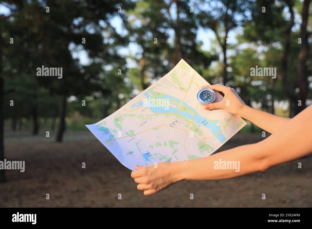 Female hiker map compass hi-res stock photography and images - Alamy
