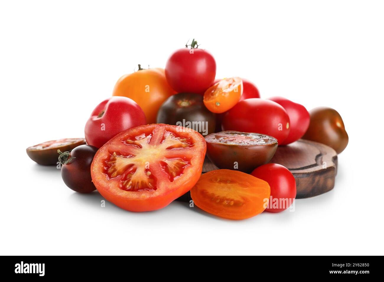 Wooden board with different fresh tomatoes on white background Stock ...