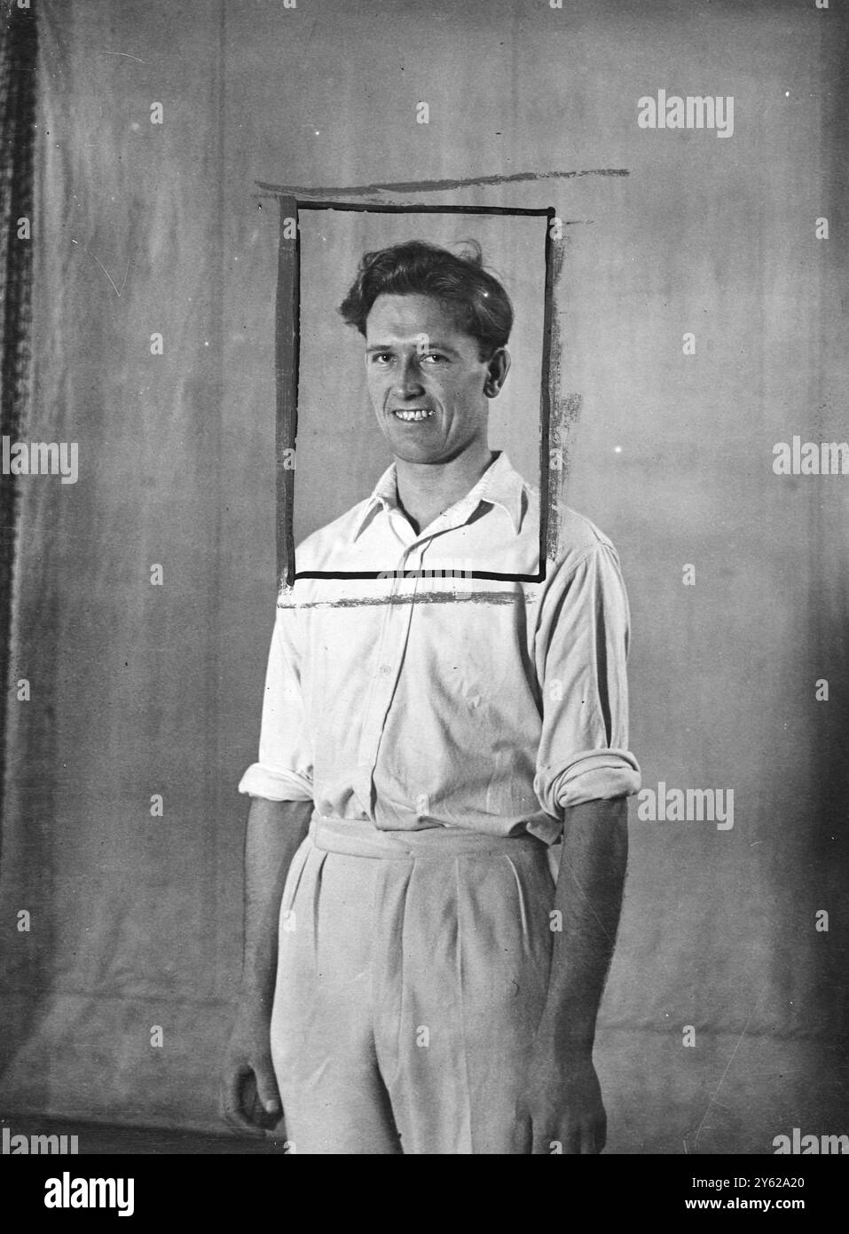 The England cricketers who leave on a playing tour of the West Indies, just after Christmas are hard at work getting into shape for the forthcoming test. They will have only about four days for practice when they arrive in Barbados, and skipper G. O. Allen has urged his men to make full use of indoor schools for getting into form. Down at Alf Golver's indoor cricket school, Wandsworth, Mauris Tremlett, the young Somerset bowling 'hope' is developing swing bowling under Gover's watchful eye. Picture shows: Maurice Tremlett of Somerst, bowling hope in the M.C.C. side to tour the West Indies.  6 Stock Photo