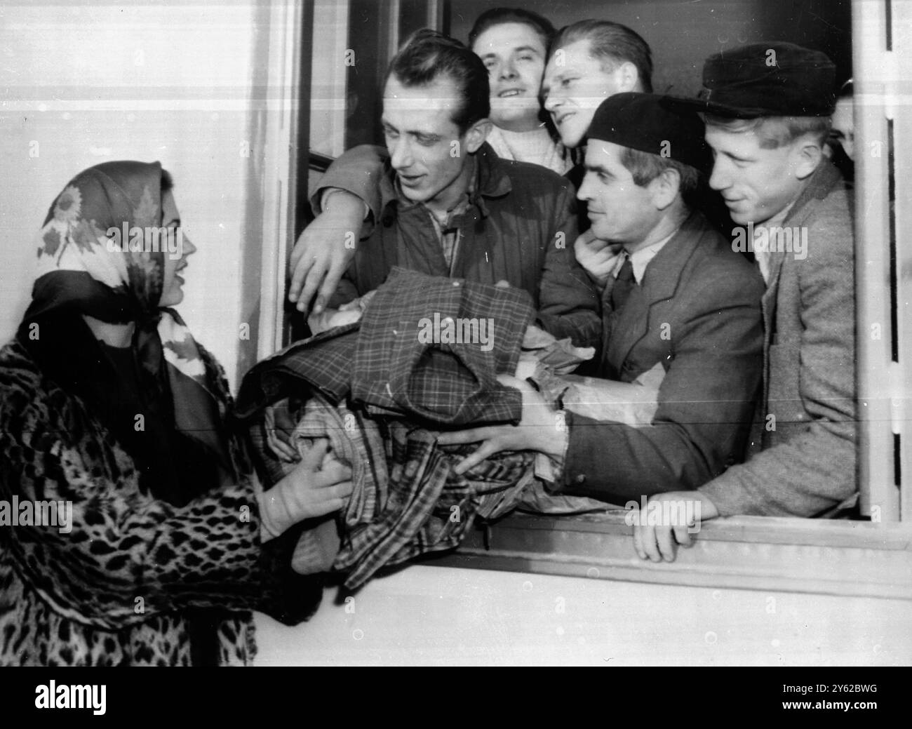 Kaisersteinbruch , near Vienna :  Fifteen year old Ira Fuerstenberg , wearing a leopard skin coat , walks among the refugees at the refugee camp at Kaisersteinbruch , south east of Vienna , arriving with two car loads of clothes and medical supplies which are gifts from the aristocrats of Bologna in Italy .  Princess Ira , who gave birth  to a son only three weeks ago , left the baby to come and hand out gifts to the refugees personally despite the cold . They stared in amazement at her leopard skin coat 25 November 1956 Stock Photo