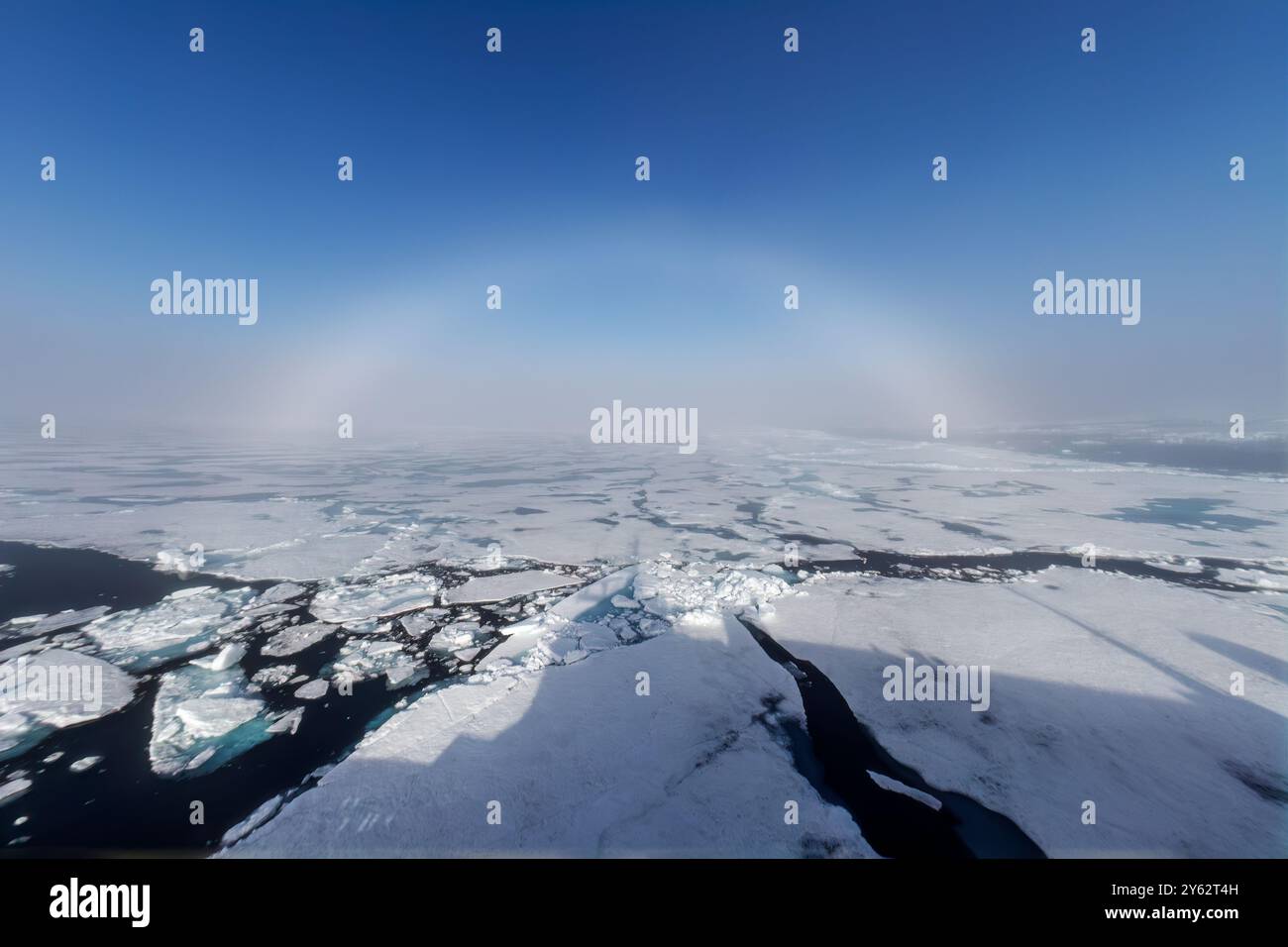 Fog and a fog bow surround the Lindblad Expeditions ship National Geographic Explorer in Palanderbutka, Norway. Stock Photo