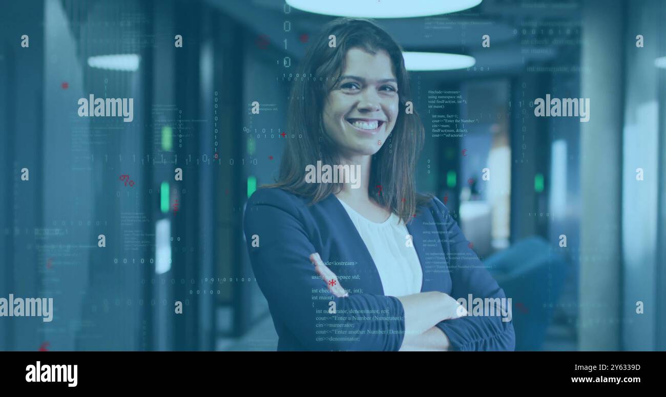 Smiling woman with crossed arms over programming code image in office ...