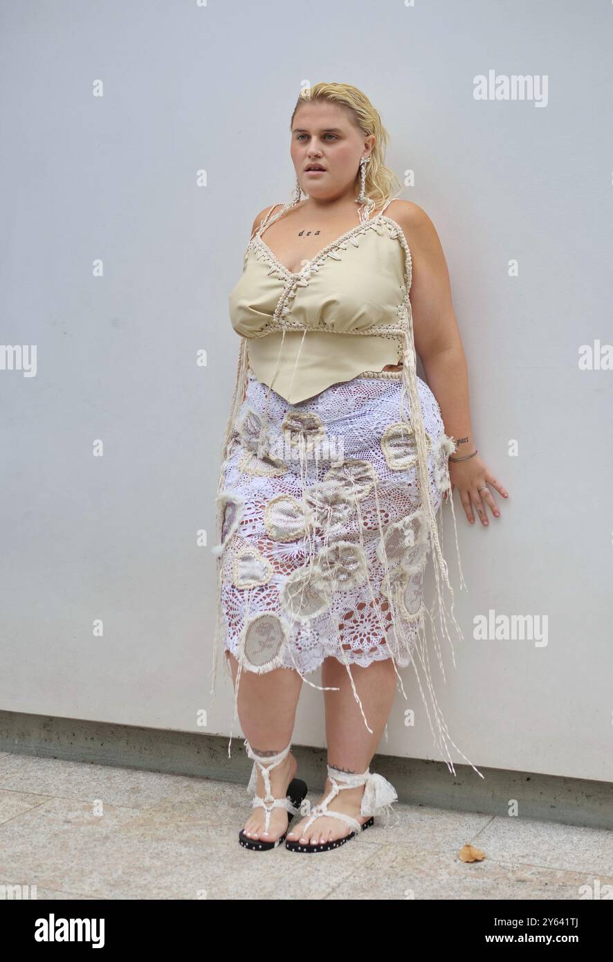 Big Mama posing for photographer during Marco Rambaldi fashion