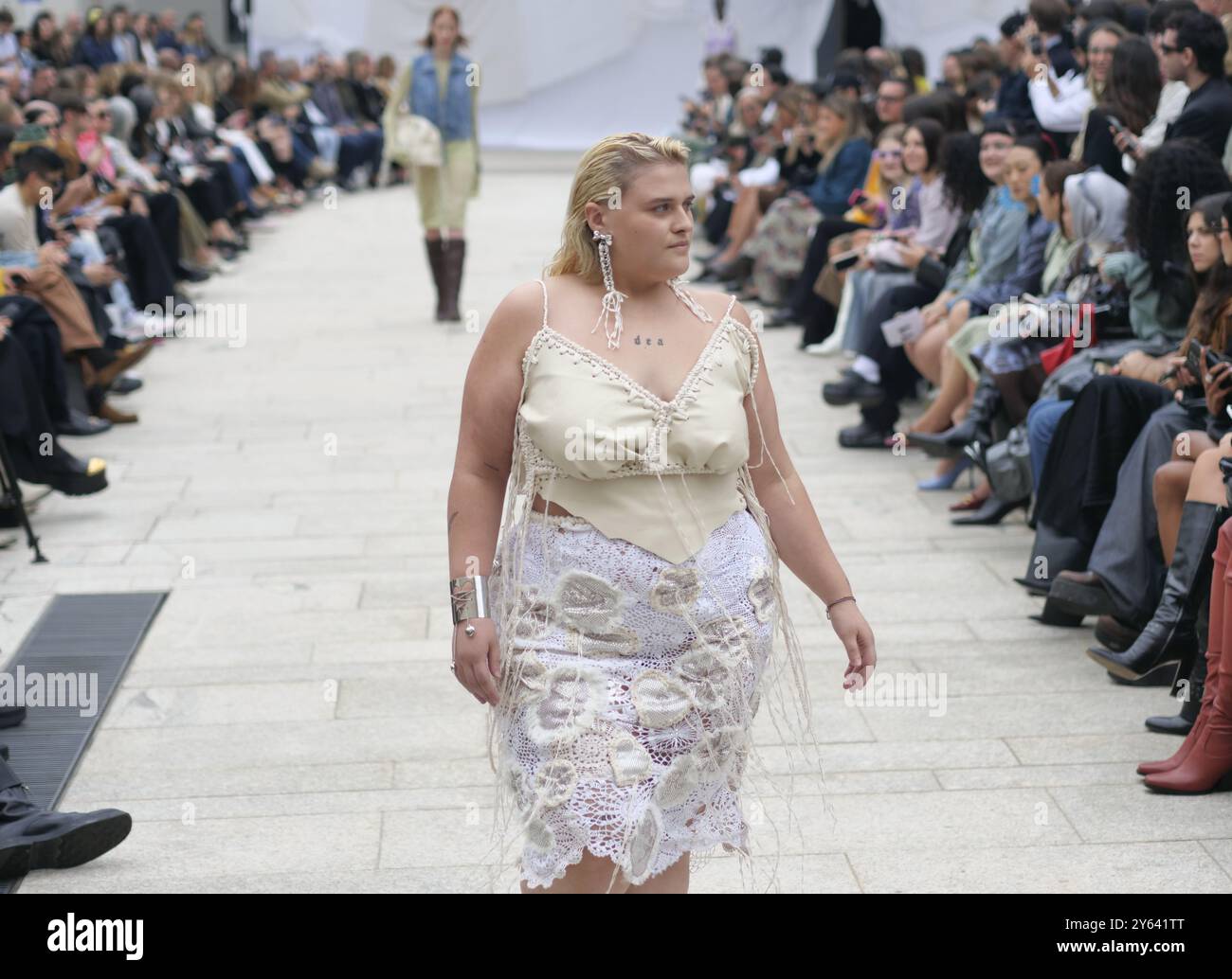 Big Mama posing for photographer during Marco Rambaldi fashion