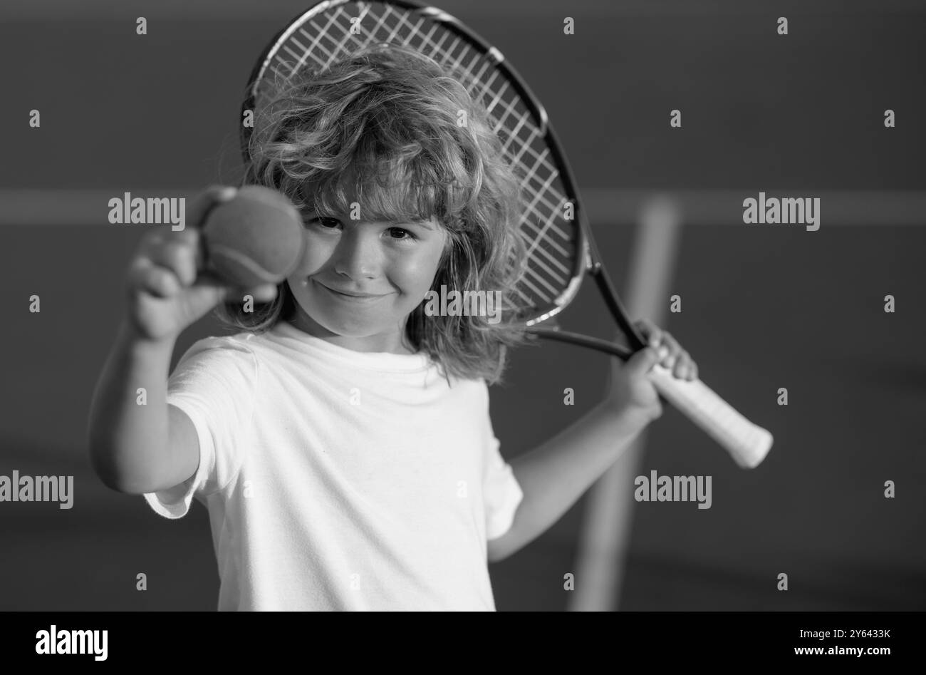 Tennis kid. Child with tennis racket and tennis ball playing on tennis ...