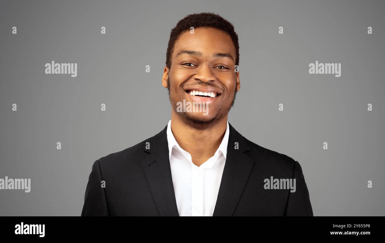 Young smiling black guy over white background Stock Photo