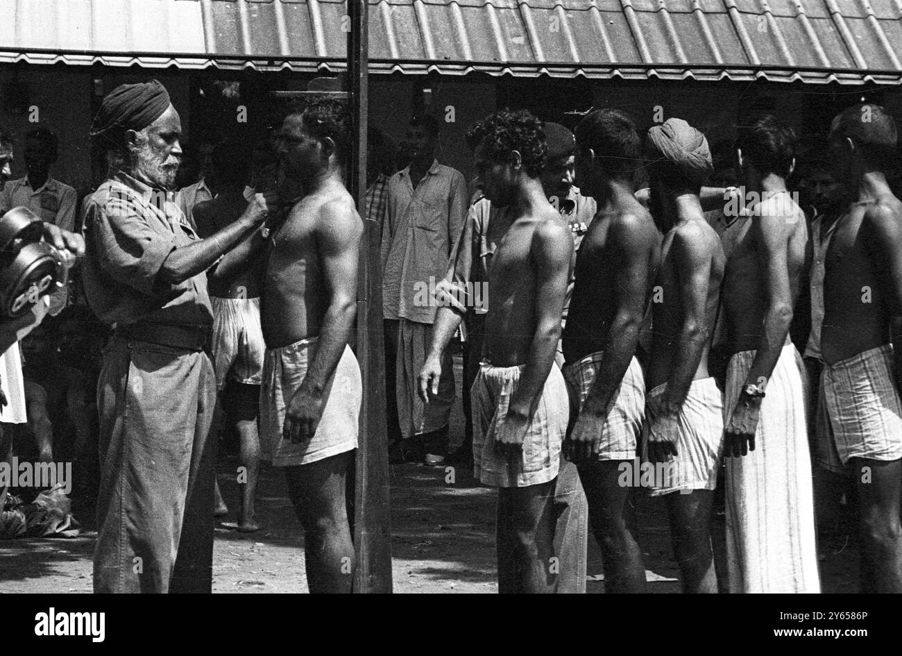 New Delhi , India ; A queue of Indians are shown today outside a Delhi ...