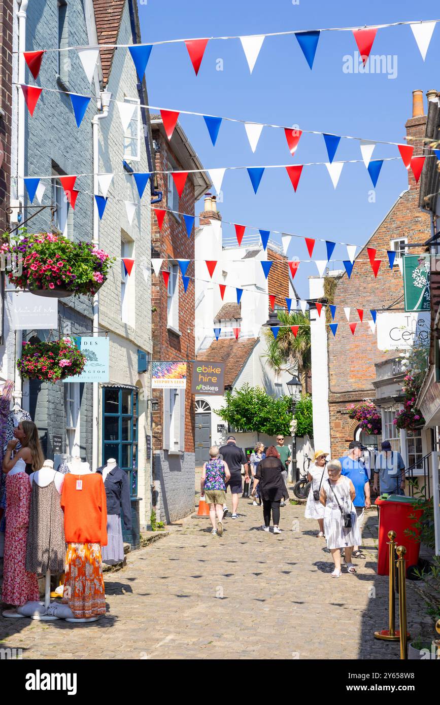 Lymington Quay hill - People walking along cobbled Quay hill a street  in Lymington Hampshire New Forest Hampshire England UK GB Europe Stock Photo