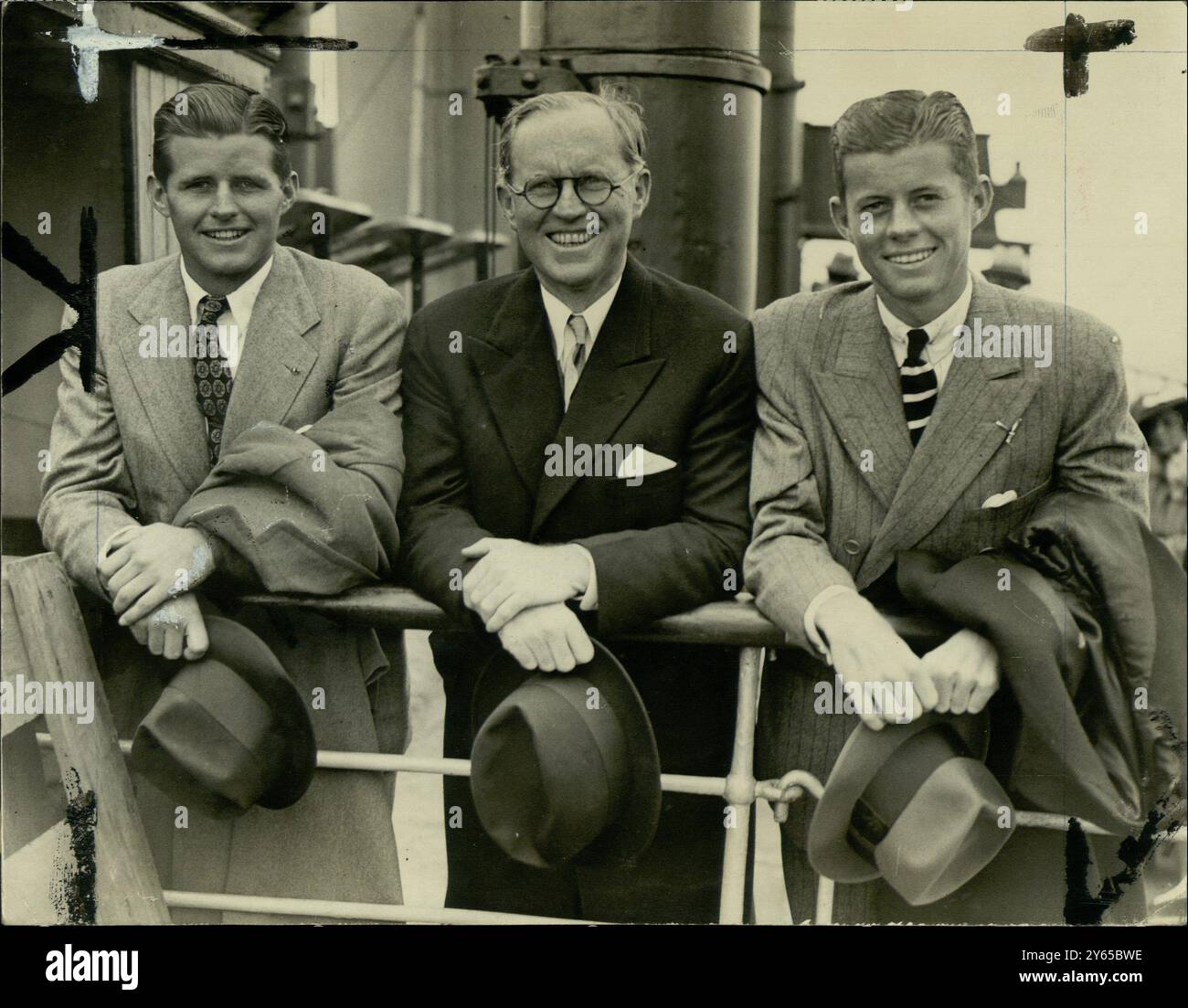 4 July 1938   Joseph Kennedy , American Ambassador to London with his sons , Joseph Jr. Kennedy and John F. Kennedy . Pictured arriving in Southampton, England on the Normandie after a visit to the USA. Stock Photo