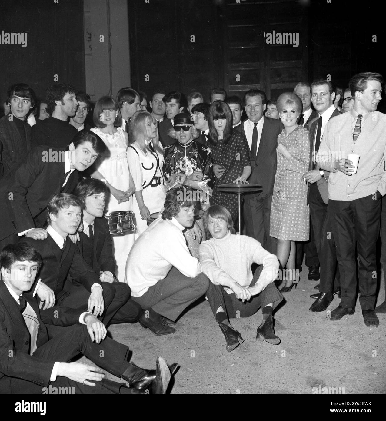 General view of poll winners of a musical magazine who gave an all star concert at the Empire Pool, Wembley today. Foreground left The Searchers, Tom Jones, Cilla Black, Twinkle , Jimmy Savile ( dark glasses) of Top of the Pops, Cathy McGowan and Keith Fordyce both of Ready Steady Go and Dusty Spirngfield. Foreground centre, Mick Jagger  ( left) and other Rolling Stones. 11th April 1965 Stock Photo