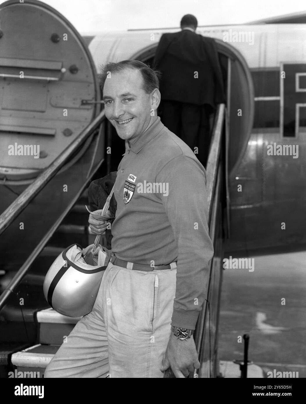 Racing driver , Les Leston , pictured at London Airport as he set off to drive a Sunbeam Rapier ...