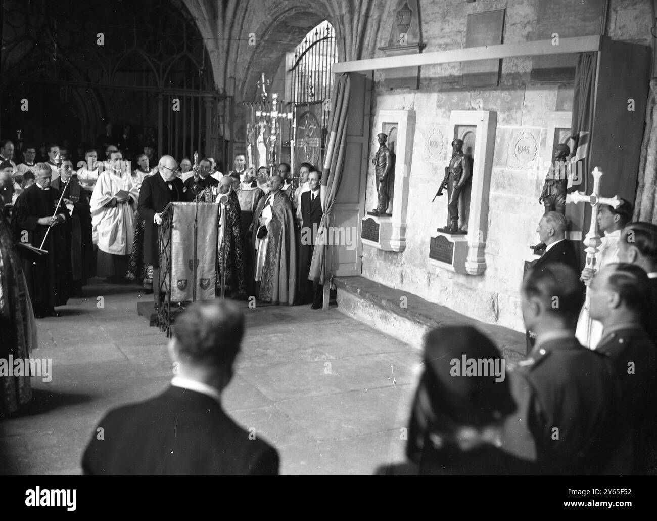 Churchill Unveils Abbey War Memorial A memorial at Westminster Abbey , to the officers and ratings of the submarine branch of the Royal Navy , who lost their lives in the 1914-18  and 1939-45 wars , and to all ranks of the Commandos and Airborne forces killed in the 1939-45 war was unveiled by Mr Winston Churchill BRitains wartime leader .   The memorial consists of three bronze figures , three feet high , desighned by Mr Gilbert Ledward . They represent a submarine man on look out , a Commando with tommy gun ready for action , and a parachutist in full equipment . They are set on stone block Stock Photo