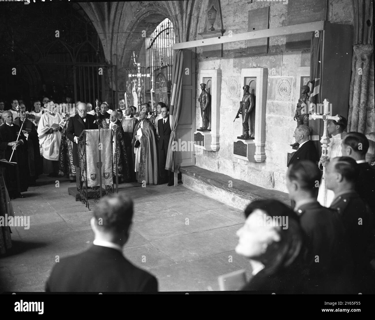 Churchill Unveils Abbey War Memorial A memorial at Westminster Abbey , to the officers and ratings of the submarine branch of the Royal Navy , who lost their lives in the 1914-18  and 1939-45 wars , and to all ranks of the Commandos and Airborne forces killed in the 1939-45 war was unveiled by Mr Winston Churchill BRitains wartime leader .   The memorial consists of three bronze figures , three feet high , desighned by Mr Gilbert Ledward . They represent a submarine man on look out , a Commando with tommy gun ready for action , and a parachutist in full equipment . They are set on stone block Stock Photo