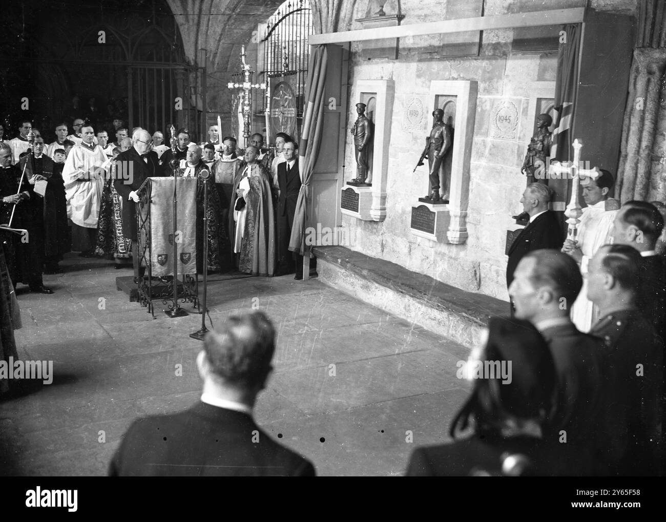 Churchill Unveils Abbey War Memorial A memorial at Westminster Abbey , to the officers and ratings of the submarine branch of the Royal Navy , who lost their lives in the 1914-18  and 1939-45 wars , and to all ranks of the Commandos and Airborne forces killed in the 1939-45 war was unveiled by Mr Winston Churchill BRitains wartime leader .   The memorial consists of three bronze figures , three feet high , desighned by Mr Gilbert Ledward . They represent a submarine man on look out , a Commando with tommy gun ready for action , and a parachutist in full equipment . They are set on stone block Stock Photo