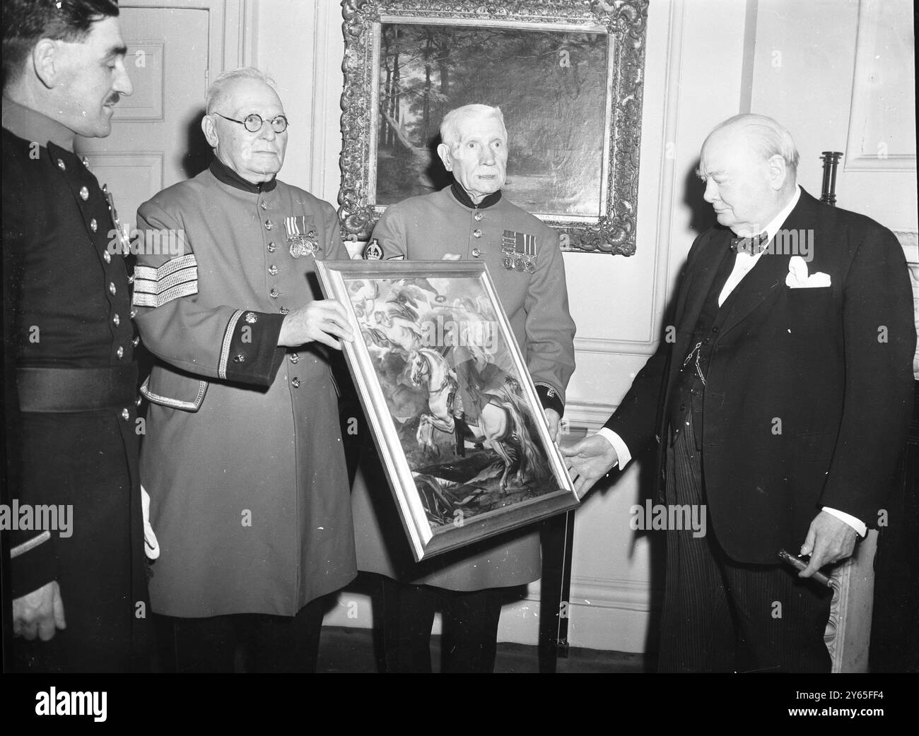 Presentation To Sir Winston The Prime Minister Sir Winston Churchill was presented with a coloured photograph of a portrait of the first Duke of Marlborough which has been presented to the Royal Hospital Chelsea . The presentation to Sir Winston was made at Downing Street by Colour Sergeant G . T . Pargiter , late of the Royal Artillery and Sergent J , F Jones late 19th Hussars  Sergeant Jones presenting the picture to Sir Winston Churchill at a ceremony at Downing Street . In the centre stands Colour Sergeant Pargiter  6th May 1954 Stock Photo