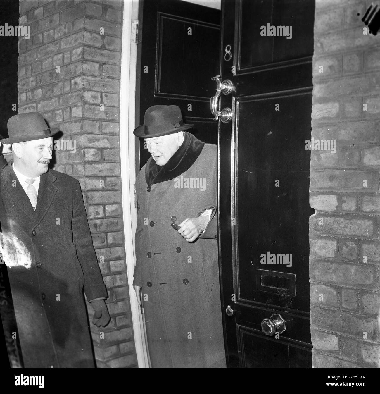 Off To Chartwell Sir Winston Churchill , wearing a fur collared topcoat , and with his usual cigar , leaves his London residence in Hyde Park Gate , to drive with Lady Churchill , to their country home at Chartwell , where they are to spend Christmas .  22nd December 1961 Stock Photo