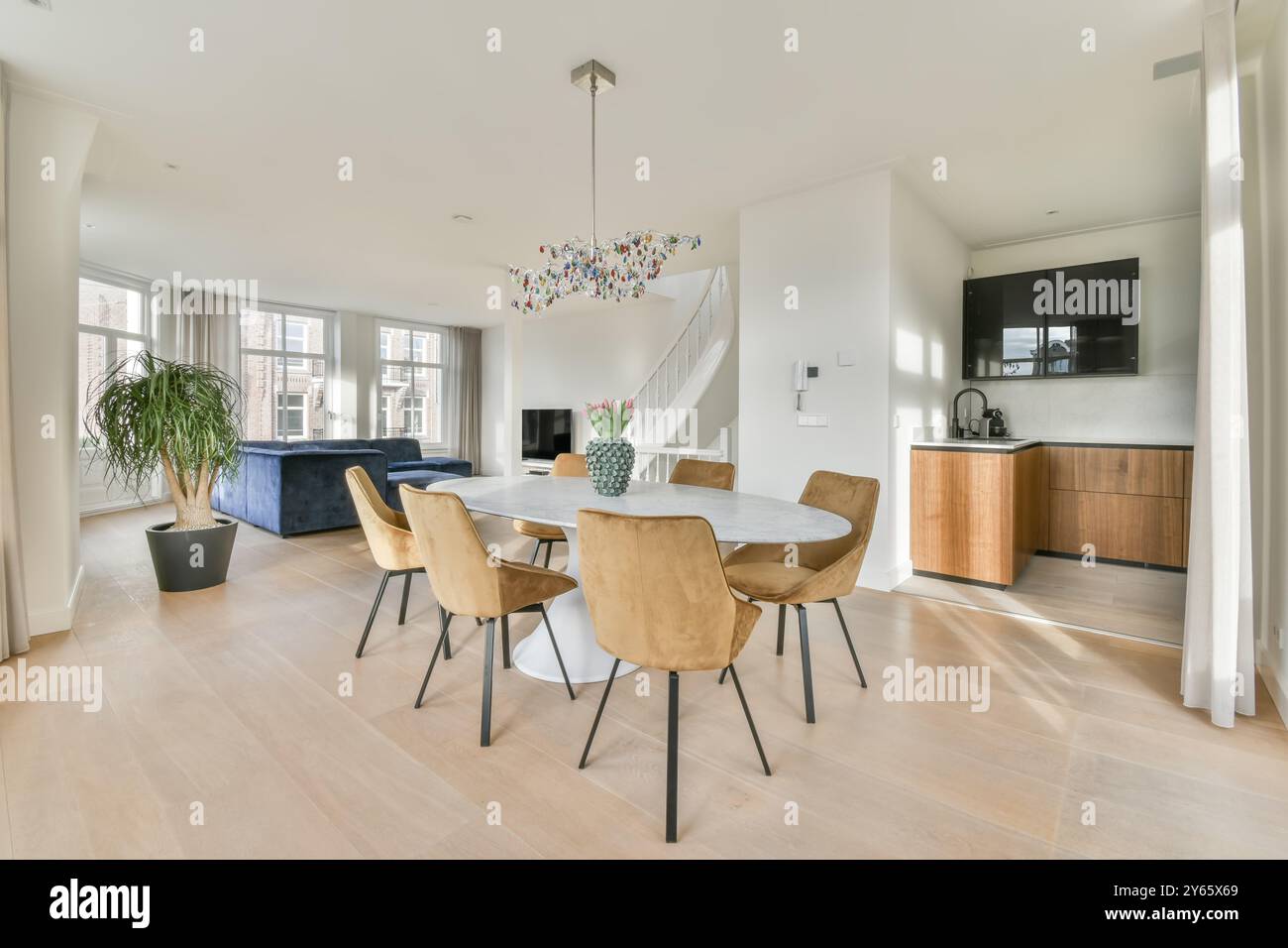 Styled modern living room seamlessly connected to the dining area with ...