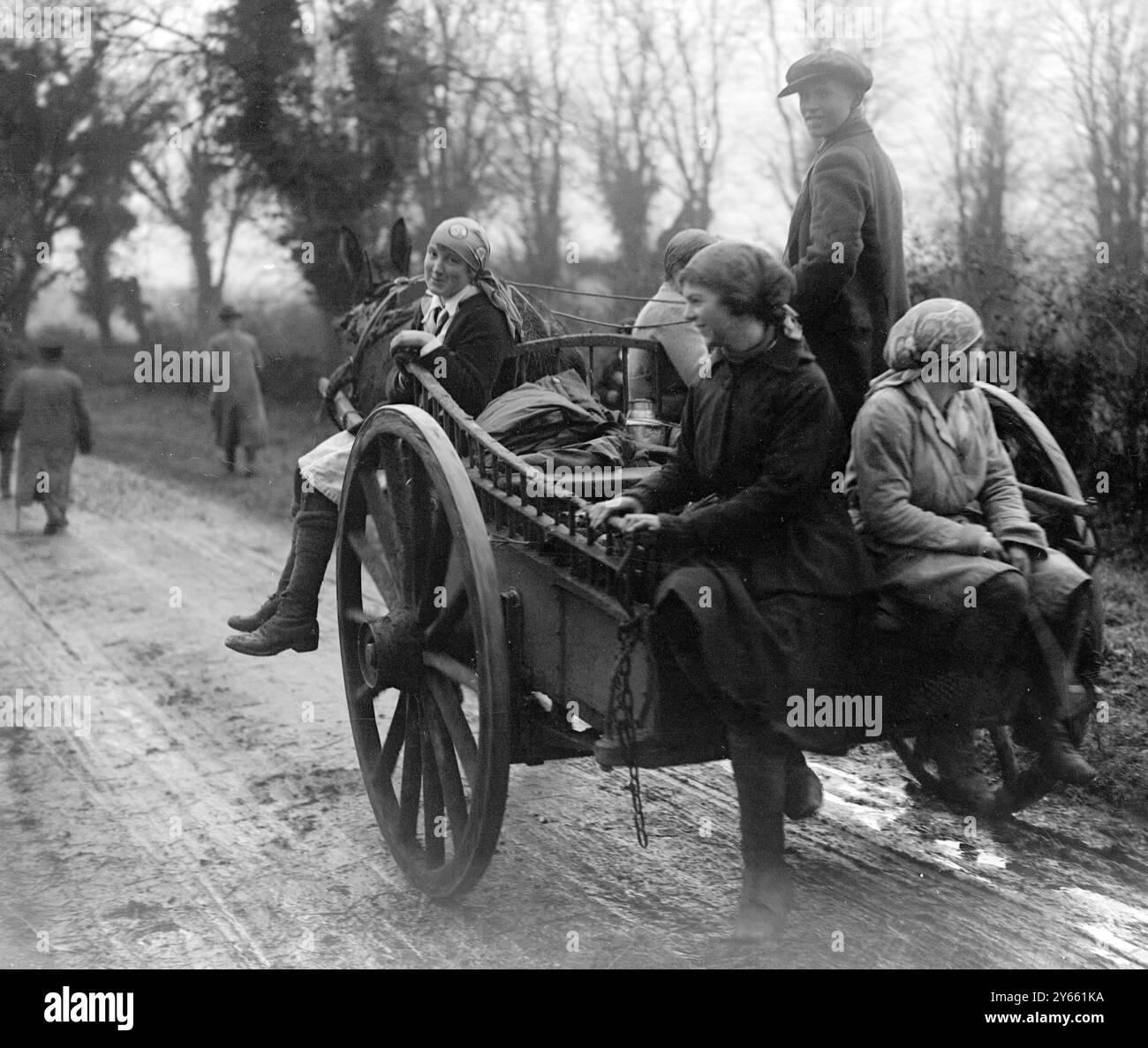 Girl beaters making their way home on the farm cart after a shoot on a ...