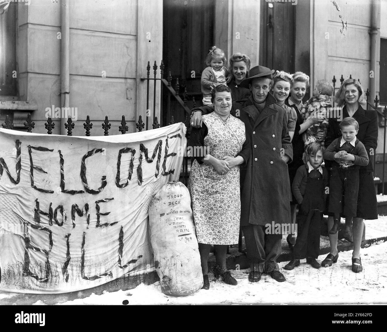 Private Bill Martin returns from the jungles of Burma to his loving family at Cambridge-place , Kilburn, London. 11th January 1945 Stock Photo