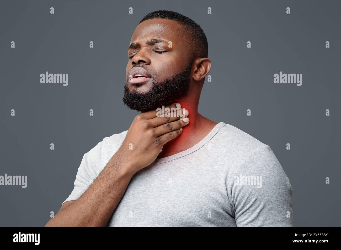 Sad afro man suffering from sore throat Stock Photo