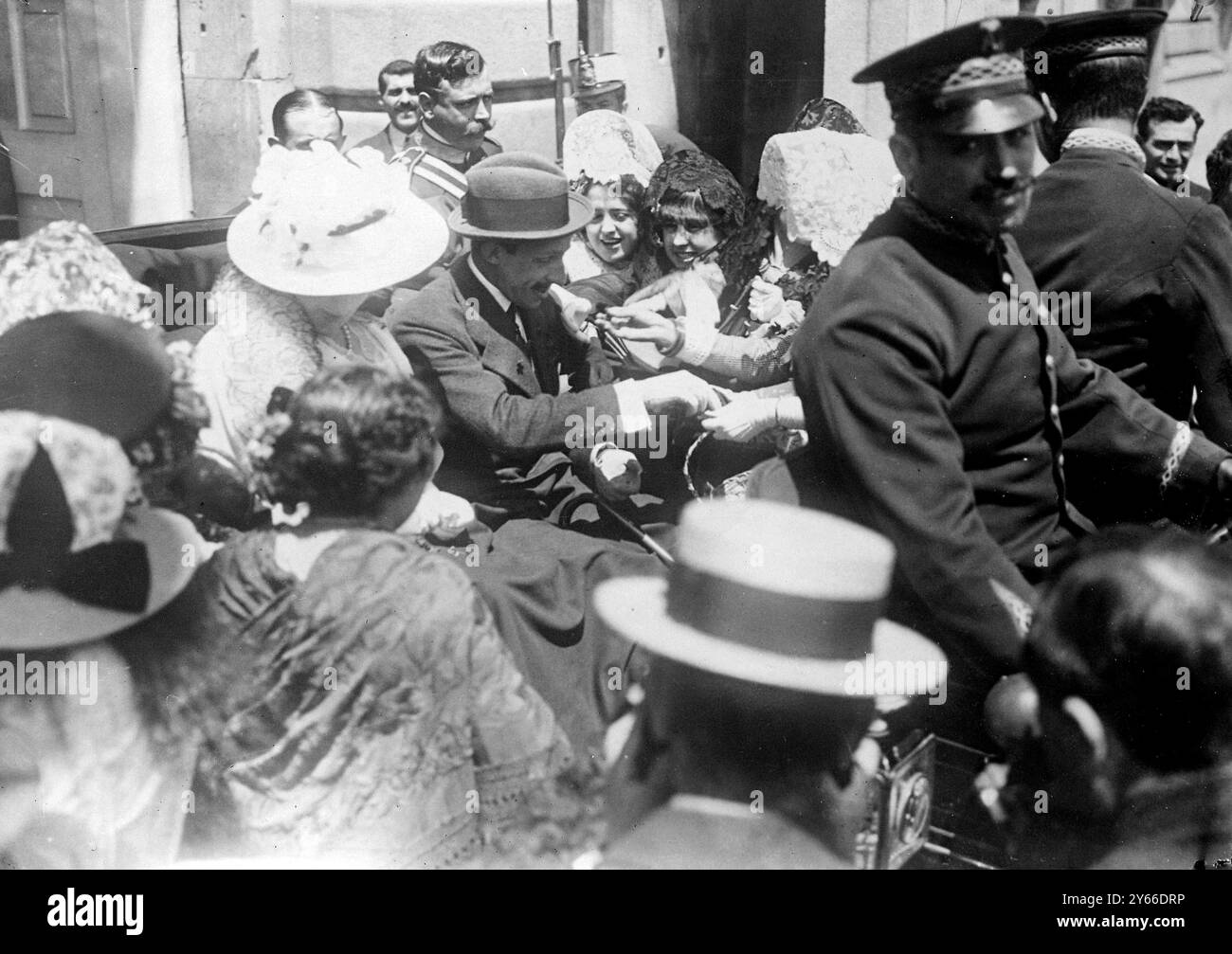 Spain King Alfonso, buying flowers on Flower Day in Madrid.   1914 Stock Photo