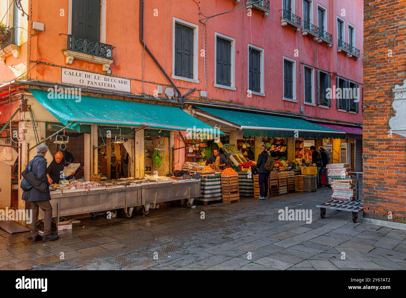 People shopping for fish and fruit and vegetables at Rialto Market in the San Polo sestiere of Venice ,Italy Stock Photo