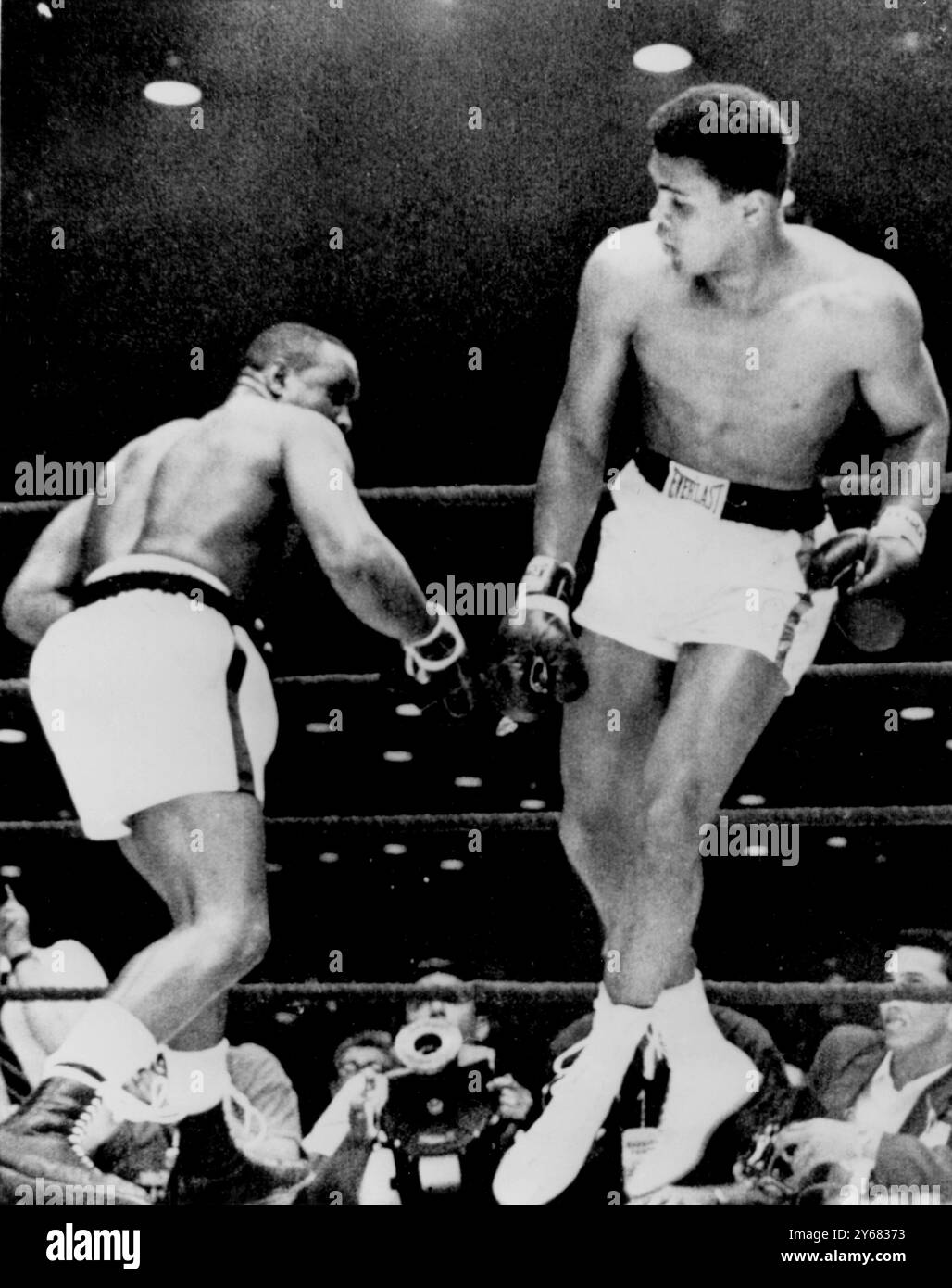 Cassius Clay is light on his feet. So much so that he is literally 'floating on air' with both feet off the ground as he dances around champion, Sonny Liston, during their world title fight at Miami Beach, Florida. Clay won a 7th round TKO to take the championship when Liston failed to answer the bell at the start of the 7th round. 25th Februrary 1964. Stock Photo