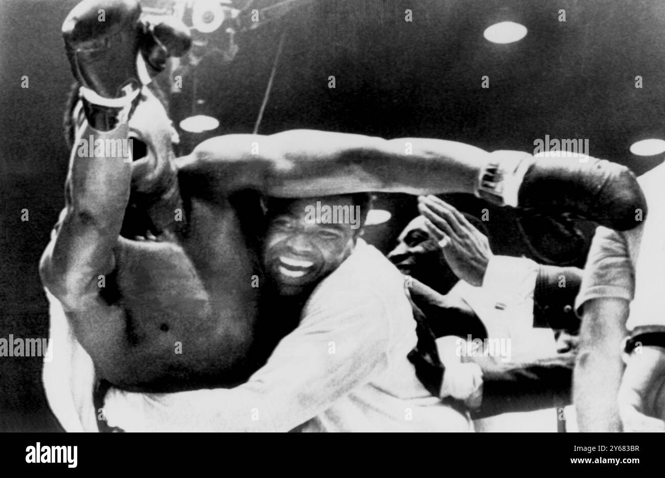 The new heavyweight champion of the world, Cassius Clay and his handlers whoop it up after Clay's sensational victory over former champion, Sonny Liston at Miami Beach, Florida. Clay won on a TKO, when the former champion failed to respond to the bell at the start of the 7th round. 25h February 1964 Stock Photo