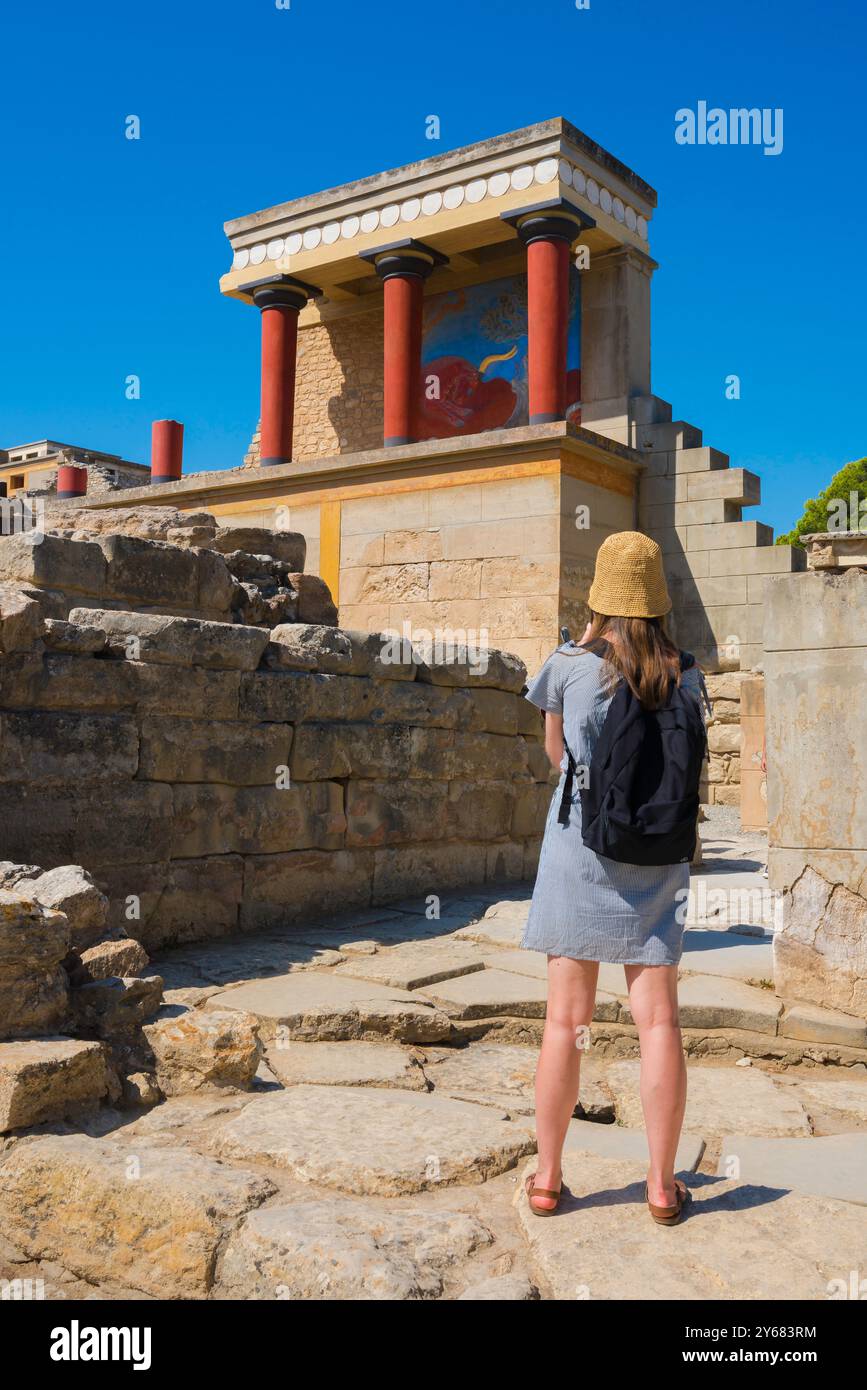 Crete Greece Knossos, rear view of a tourist taking a photo of the mural known as the Bull Relief sited in the ancient Minoan palace at Knossos, Crete. Stock Photo