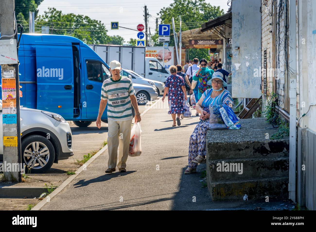 The Circassian Adygean people at Maykop city street at Adygea Republic, Russia, during the hot summer day in Northern Caucasus. Stock Photo