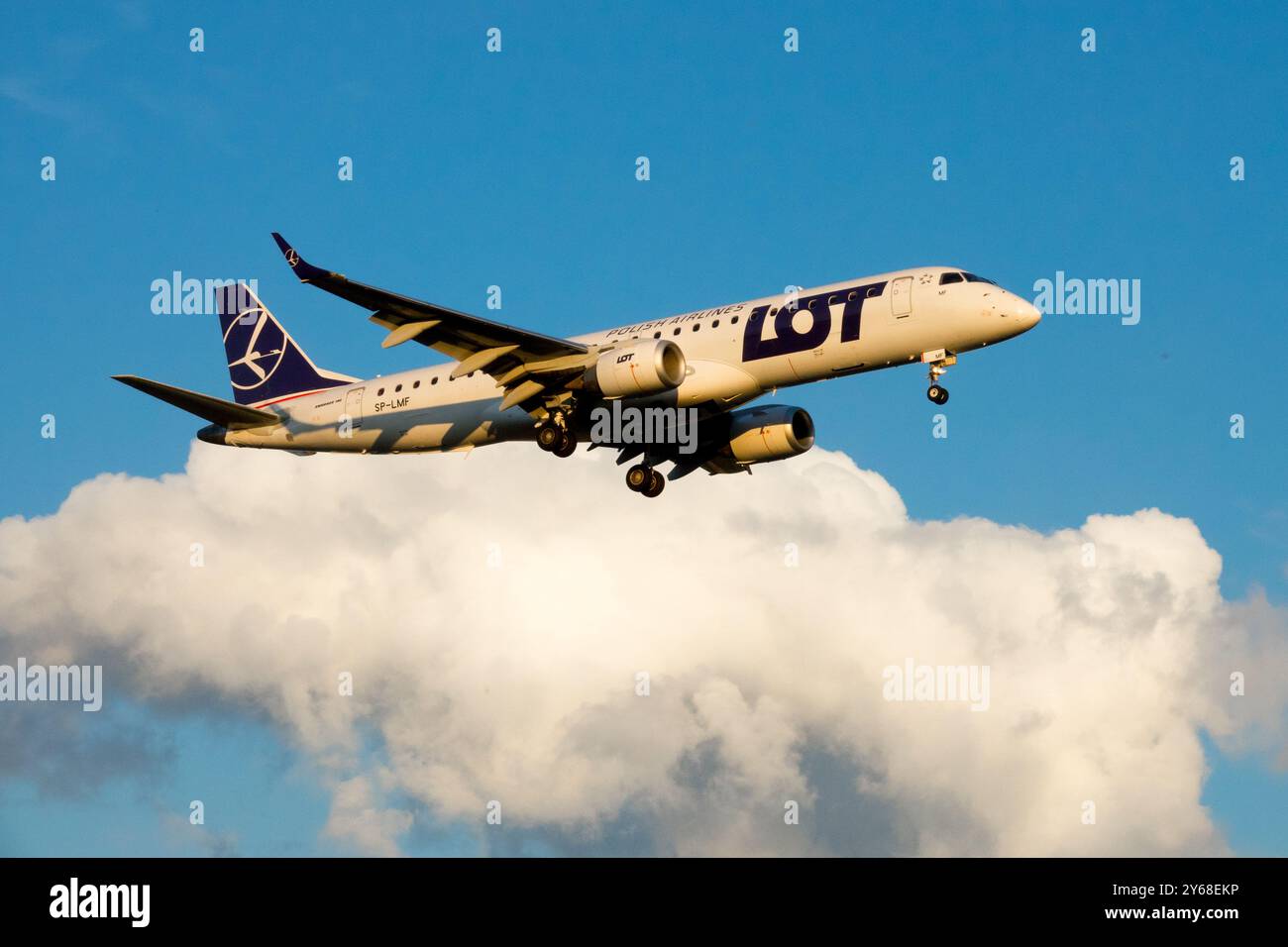 Plane Aircraft Airplane Jetliner Passenger Jet Airliner, Landing Approaching Flight Embraer E195LR Stock Photo