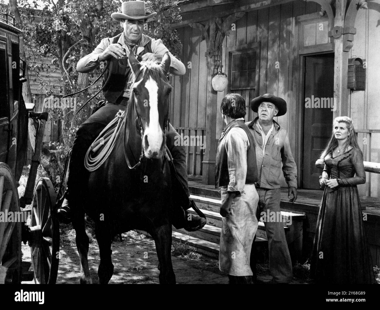 Rory Calhoun, Lon Chaney, Jr., Corinne Calvet, on-set of the western film, 'Apache Uprising', Paramount Pictures, 1965 Stock Photo