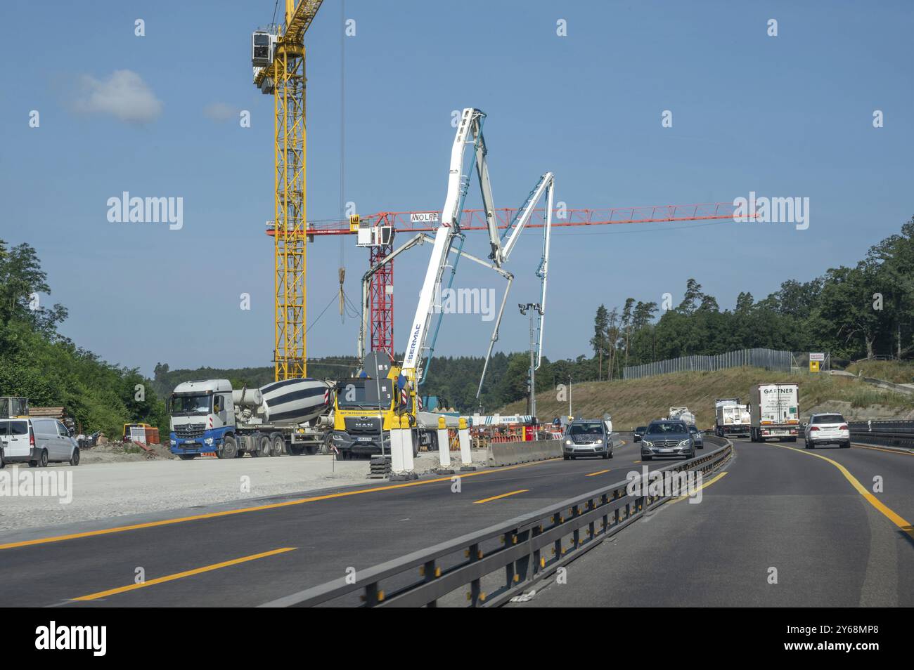 Construction cranes at a building site on the A6 motorway, Bavaria, Germany, Europe Stock Photo