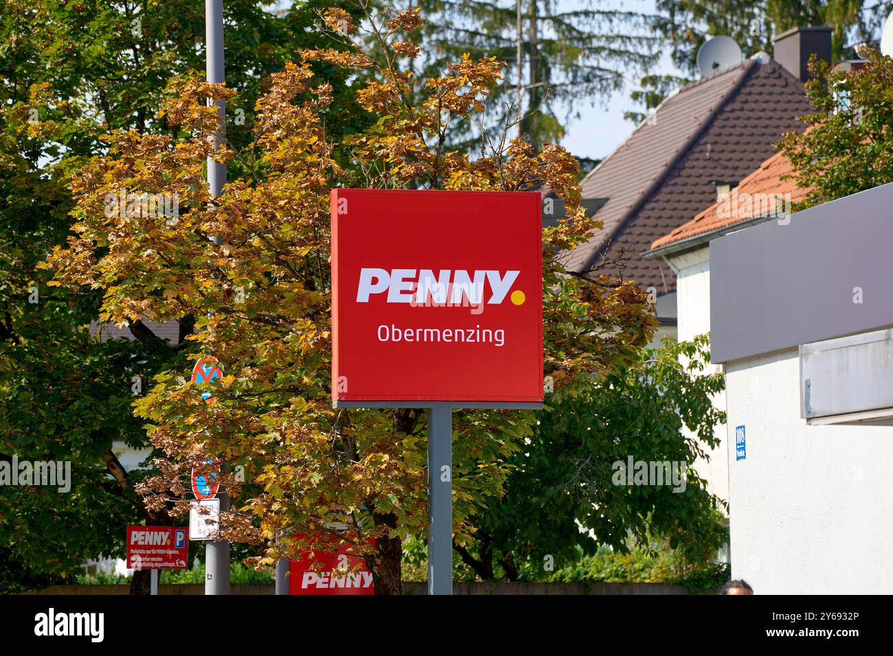 Munich, Bavaria, Germany - September 23, 2024: Sign with red logo of ...