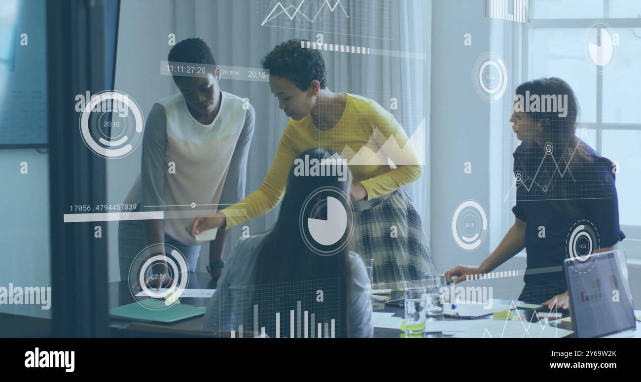 Business data analytics image over diverse team collaborating in office Stock Photo