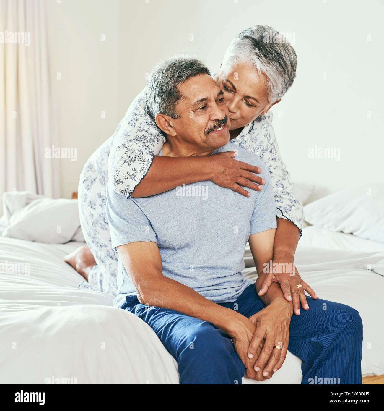 Mature couple kissing in bed hi-res stock photography and images - Alamy