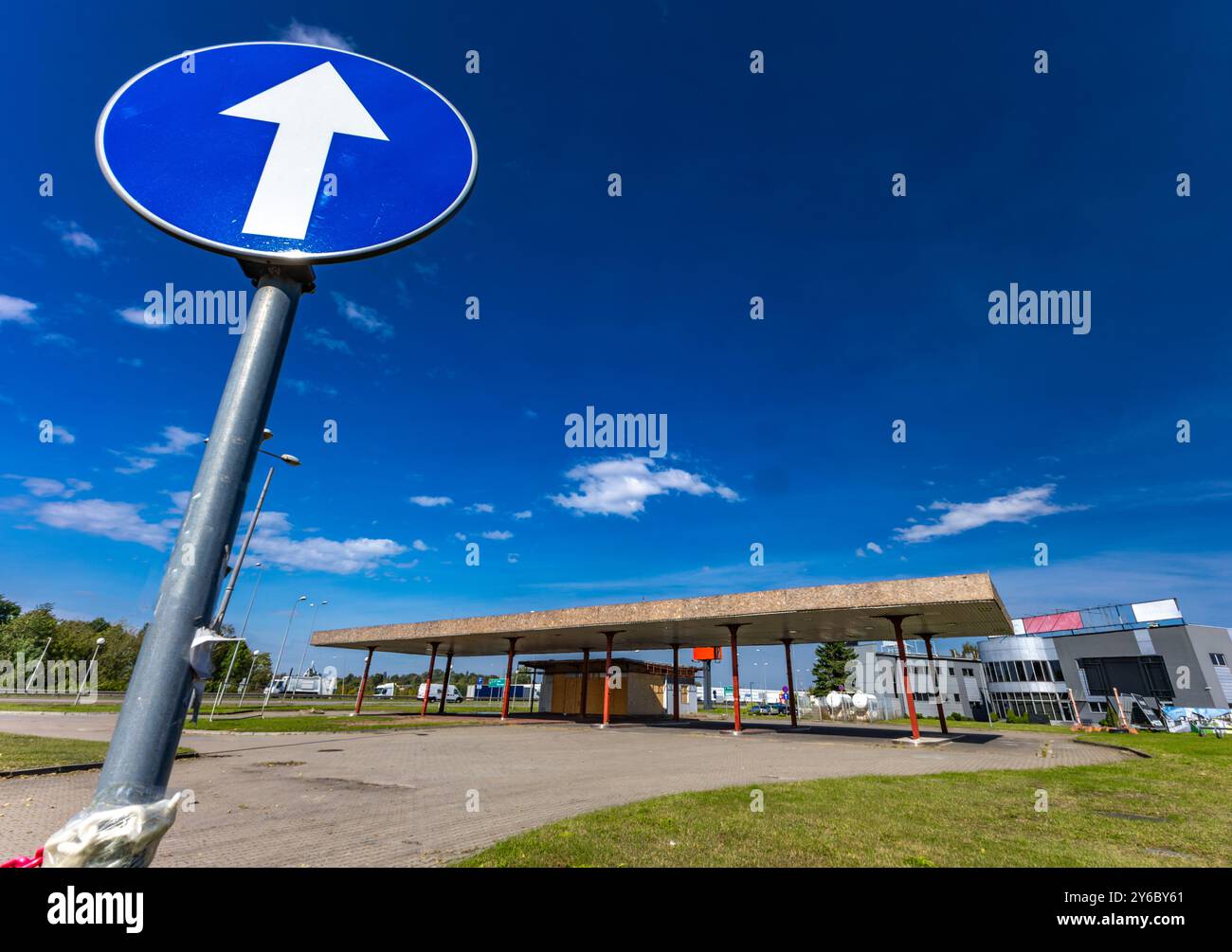 Inactive and abandoned gas station, inactive dispensers, boarded up ...