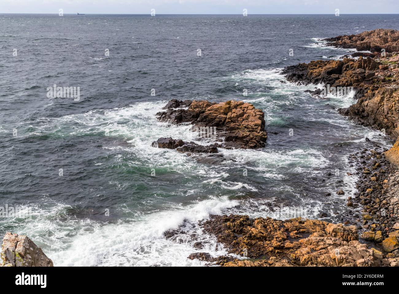 A stretch of coastline on the Kullen peninsula in north-western Skåne, Sweden. The peninsula stretches between the village of Arild and the Kullen lighthouse and juts out into the Kattegat. The Kullaberg peninsula is a nature reserve. Italienska vägen, Höganäs kommun, Skåne, Sweden Stock Photo
