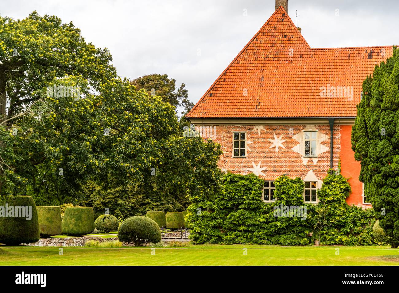 Krapperups Slott is one of the oldest and historically most important manor houses in Skåne. Extensive renovations in the 17th and 18th centuries gave the castle its present appearance, with distinctive seven-pointed stars on the façades and the Gyllenstierna family coat of arms. Krapperup Castle and Park. Krapperups Kyrkoväg, Höganäs kommun, Skåne, Sweden Stock Photo