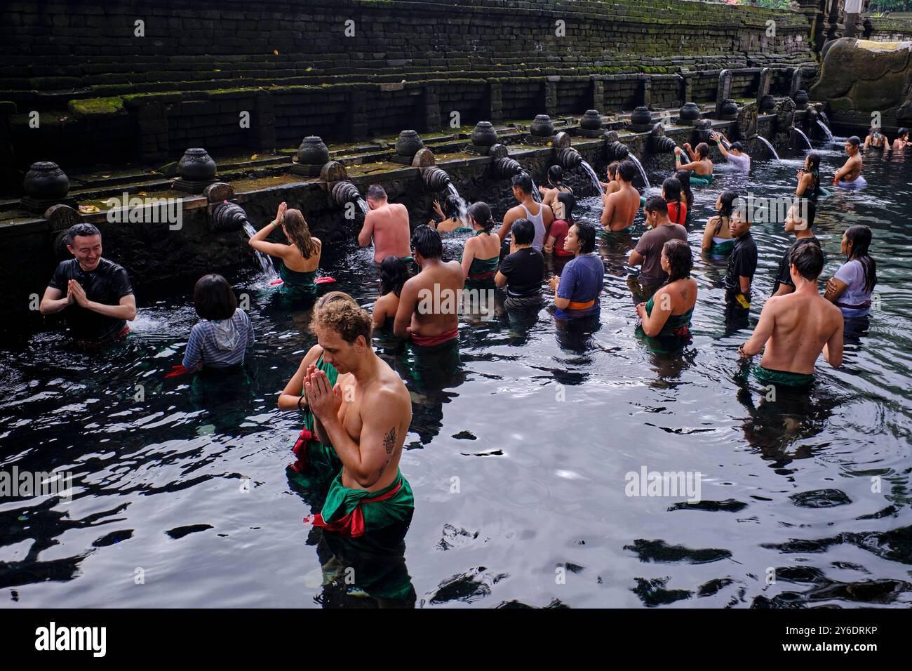 Indonesia, Bali, Ubud area, Pura Tirta Empul temple, tourists take over the sacred baths during organized tours Stock Photo