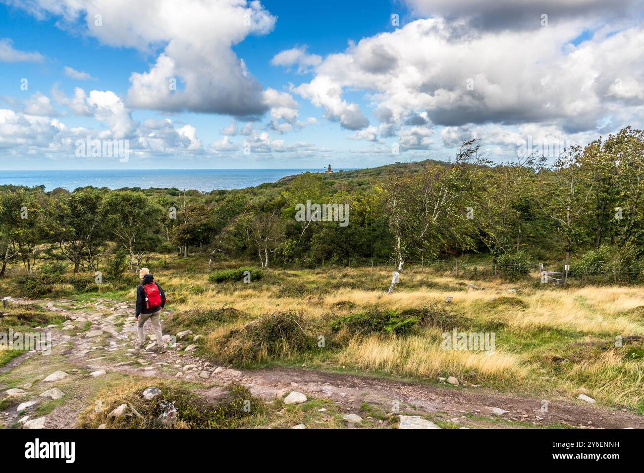 Coastal hike from Mölle harbor to Kullen lighthouse in the Naturum Kullaberg nature reserve. At the tip of the Kullaberg peninsula stands the Kullens fyr lighthouse. Italienska vägen, Höganäs kommun, Skåne, Skåne, Sweden Stock Photo