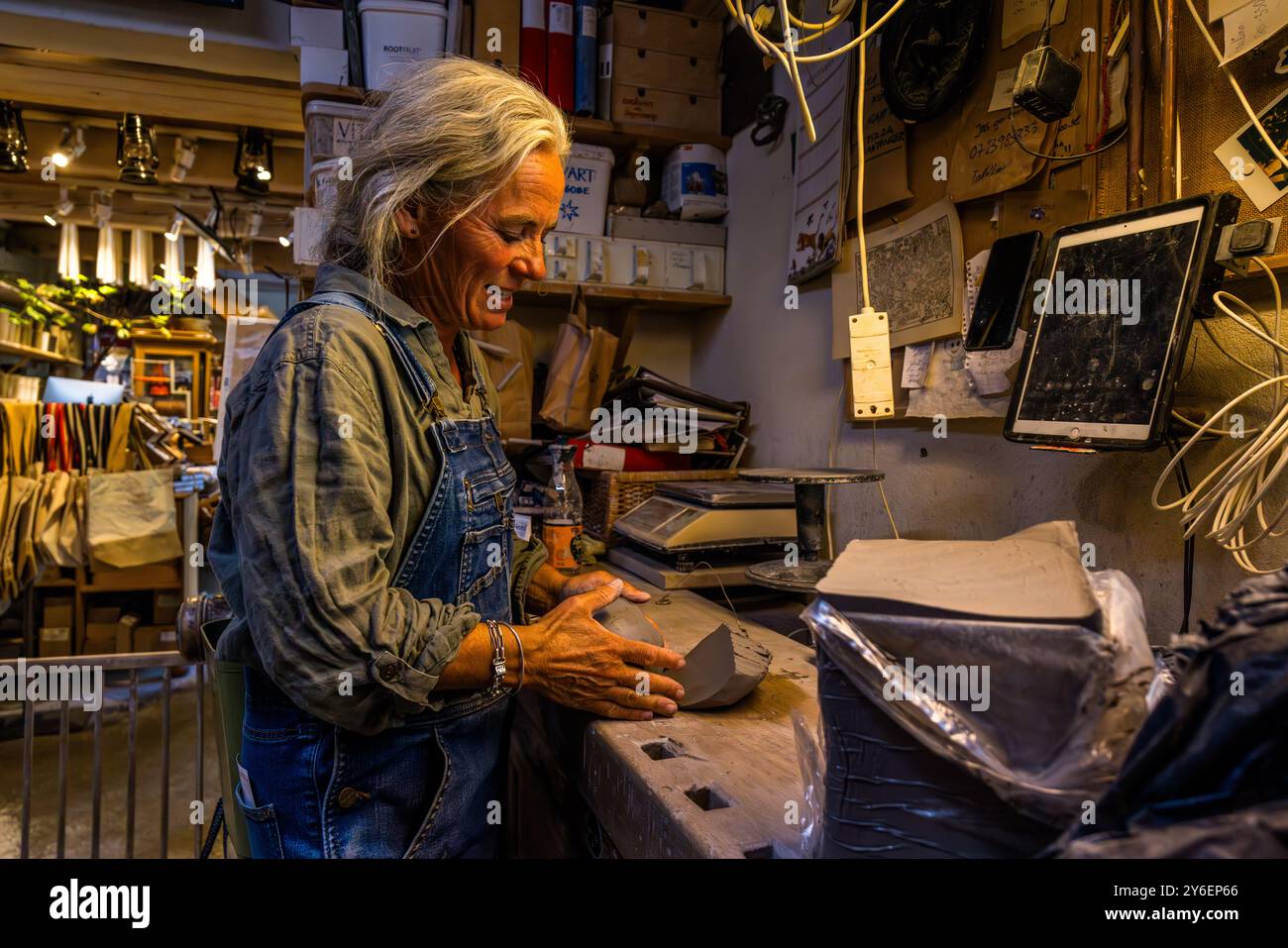 Ceramic artist Lisa Wohlfahrt has been running a pottery workshop with a restaurant and café as well as a shop selling pottery and souvenirs in the seaside resort of Mölle, Mölle Krukmakeri, since 1997. Lisa Wohlfahrt, Krukmakeri, Mölle, Sweden. She has been running a pottery with a café, restaurant and store since 1997. Mölle Krukmakeri has grown from a pure pottery business into a trendy shop and restaurant. Mölle hamnallé, Höganäs kommun, Skåne, Sweden Stock Photo