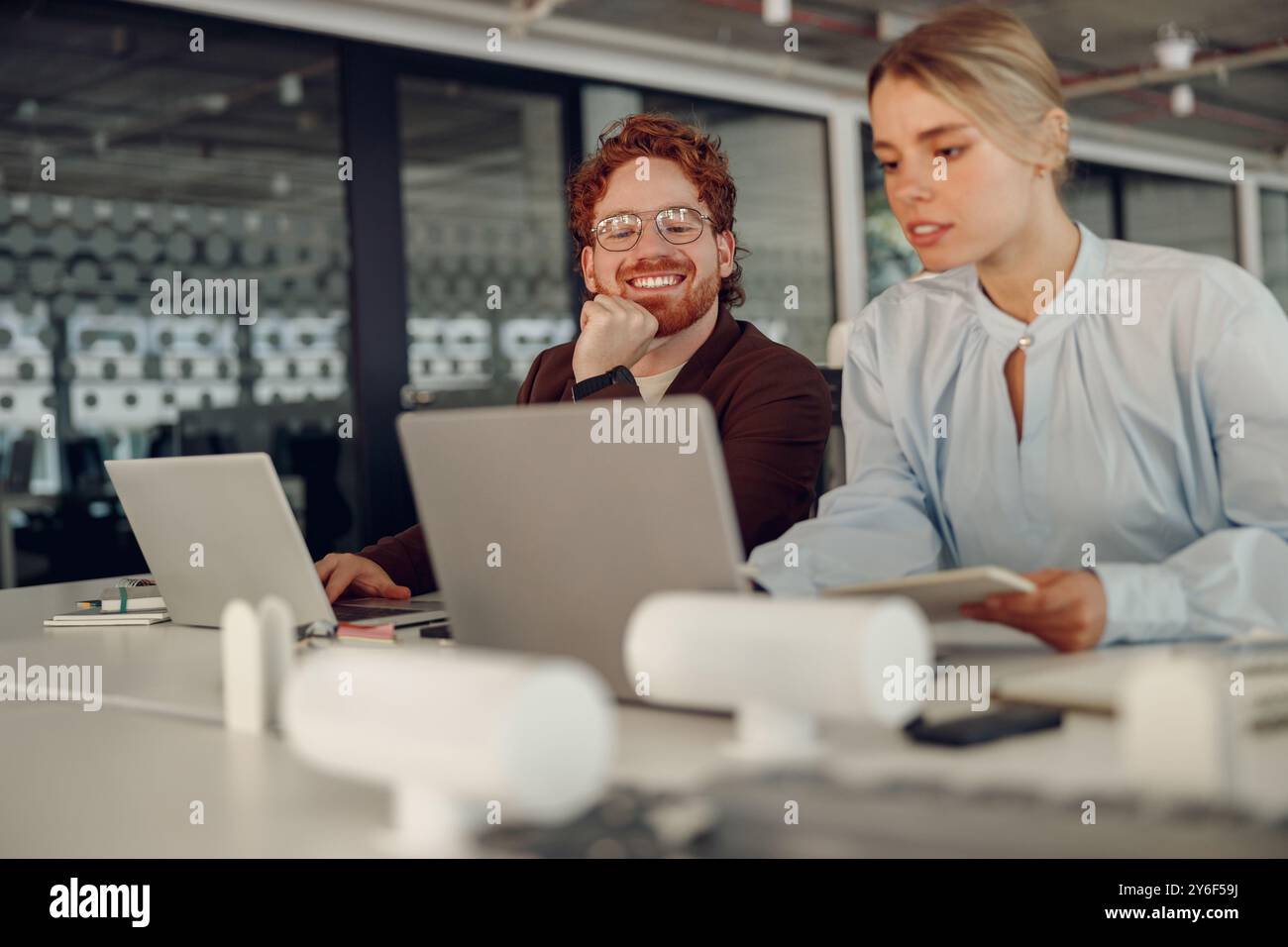 Engaging in Collaborative Work within the Dynamics of a Modern Office Environment Stock Photo