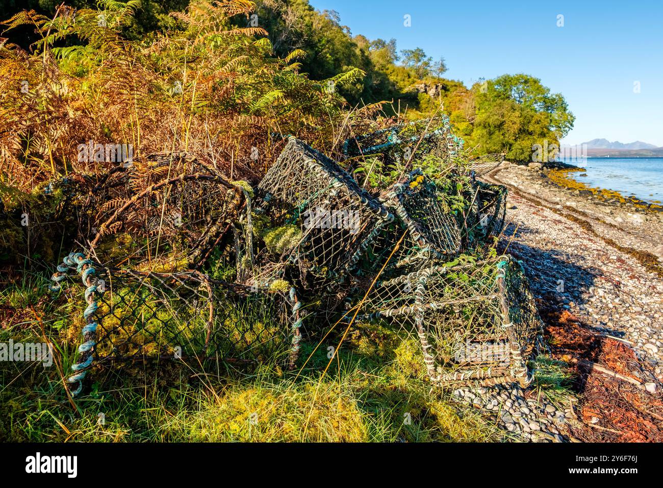 Disused lobster pots on a beach, Knoydart, Scotland,UK Stock Photo