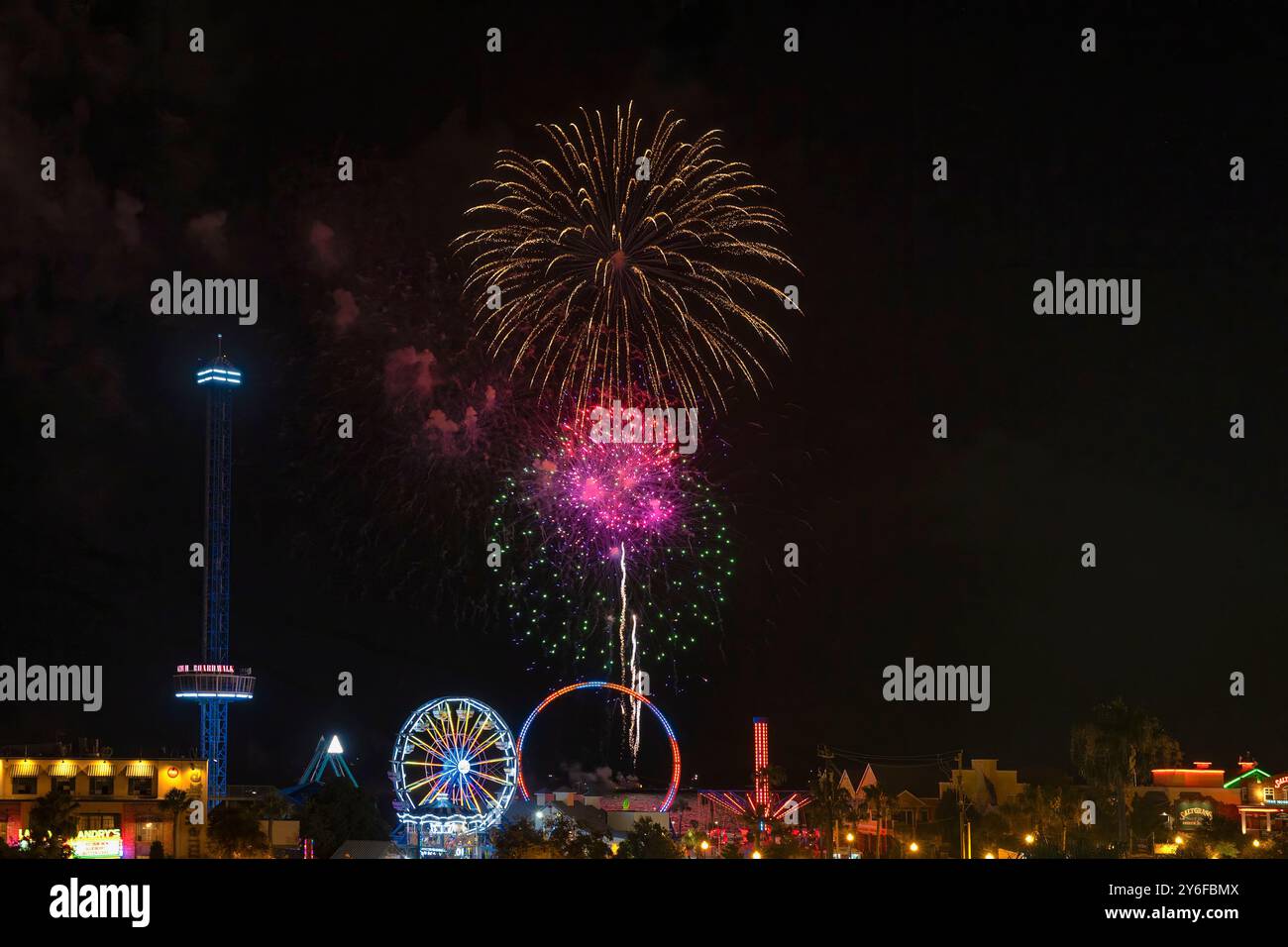 Kemah, Texas, USA - June 21, 2024: Summertime every Friday night fireworks at Kemah Boardwalk. Stock Photo