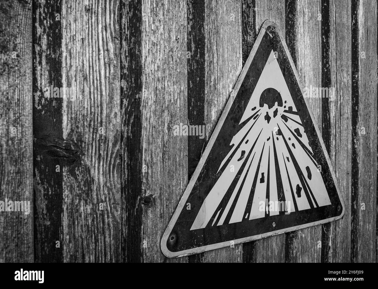 Explosives sign on a weatered wooden door. Stock Photo