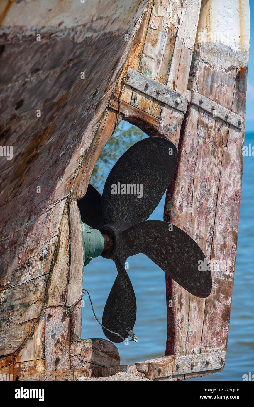 weather beaten and distressed old vintage ship or boat propellor and ...