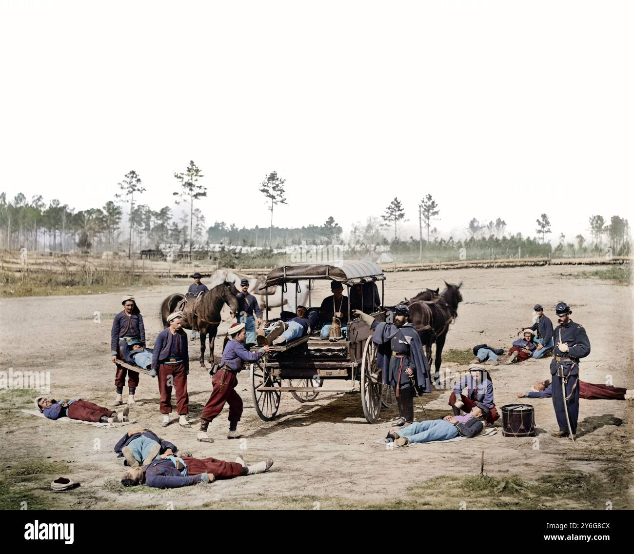 Ambulance drill at Headquarters Army of Potomac, near Brandy Station, Virginia., March, 1864. Zouave ambulance crew demonstrating removal of wounded soldiers from the field. Photographed by William Frank Browne. Glass negative, Stereograph, wet collodion. My personal research suggests that the soldiers shown here are from the 114th Pennsylvania regiment. The distinctive Cuff patch and trouser embroidery around the pocket area is the reason for this conclusion. Stock Photo