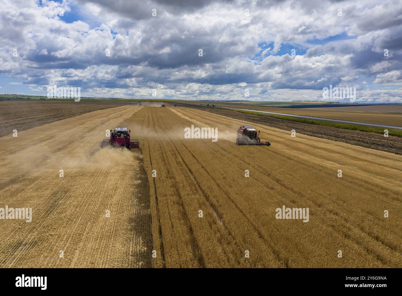Aerial view of combine harvester working in golden wheat field Stock ...